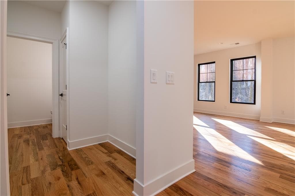 Hallway with black framed windows