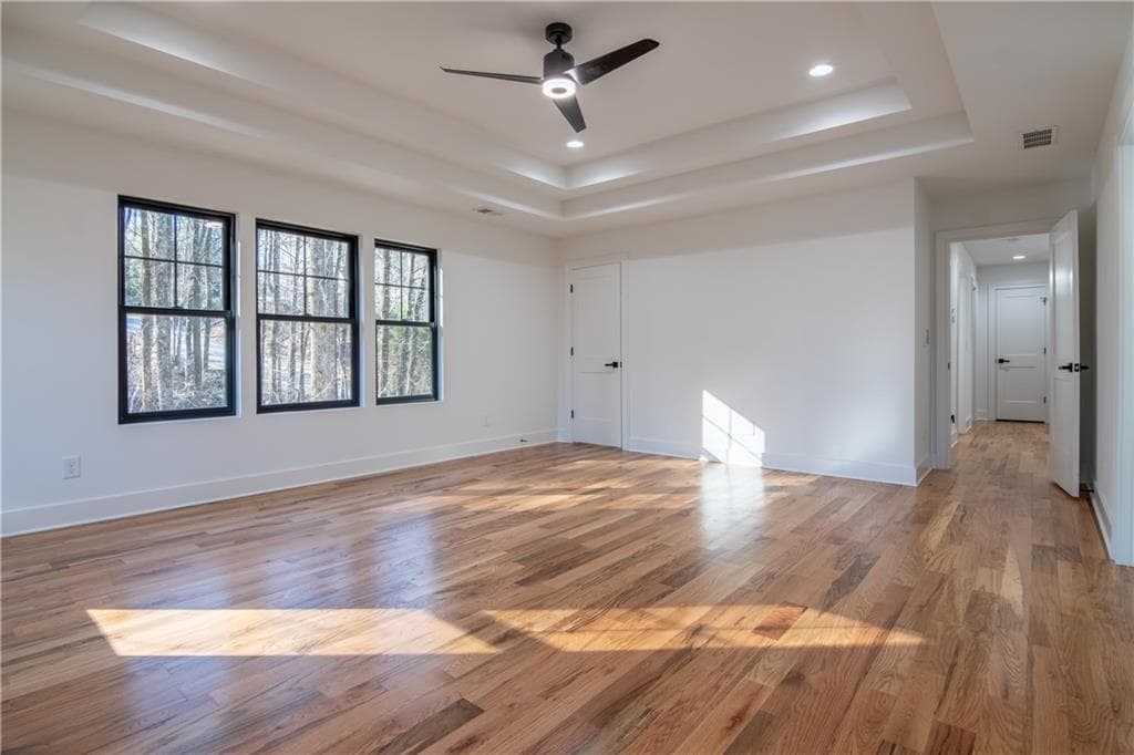 Primary bedroom with tray ceiling